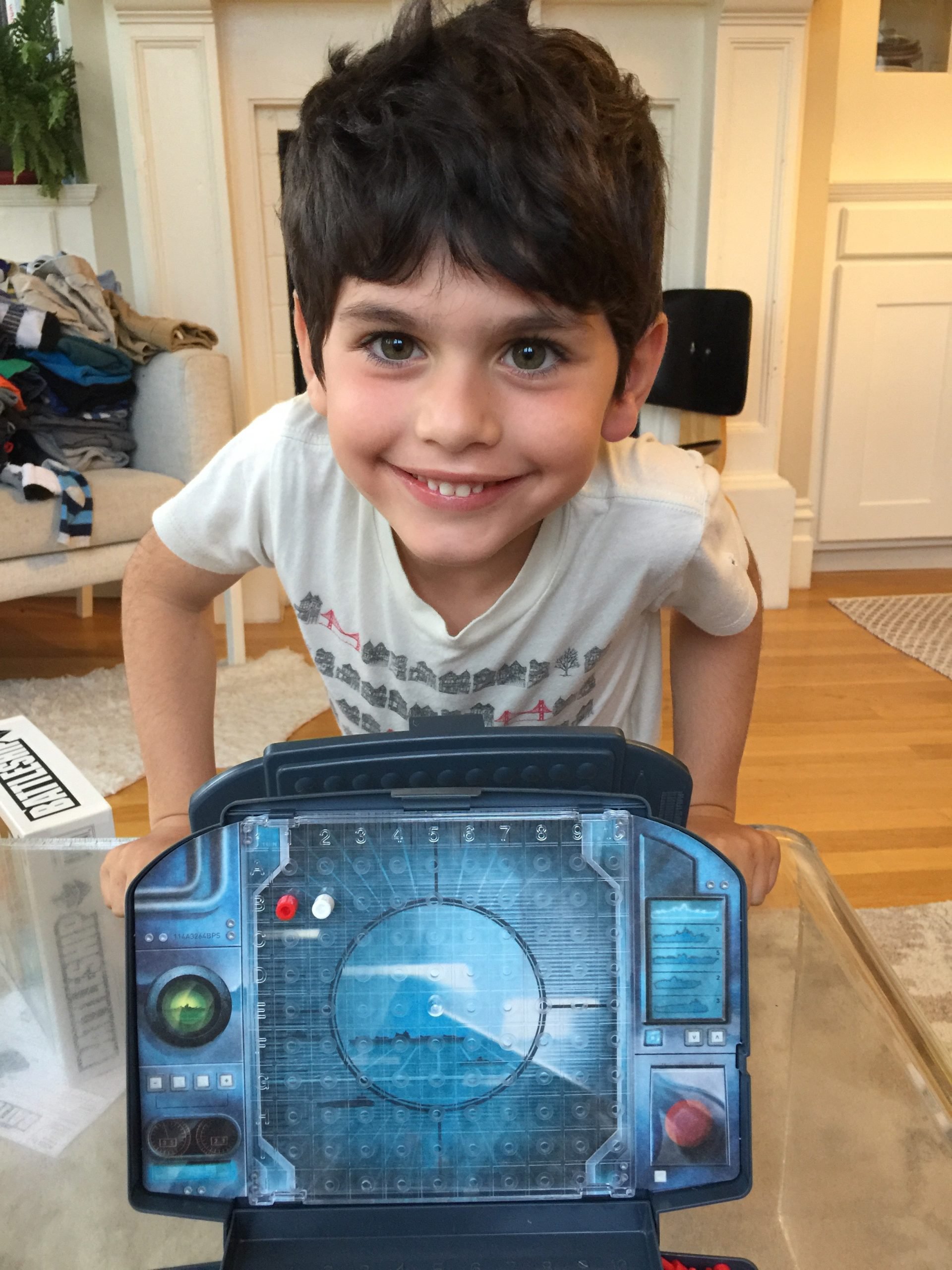 Saul learns battleship - this boy is a fierce competitor